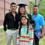 Lisa Jimenez poses with her degree, her husband Martin, son Jonathan and daughter Jomayra. She received her degree from Colorado Christian University at Cherry Hills Community Church in Highlands Ranch on Saturday May 10.